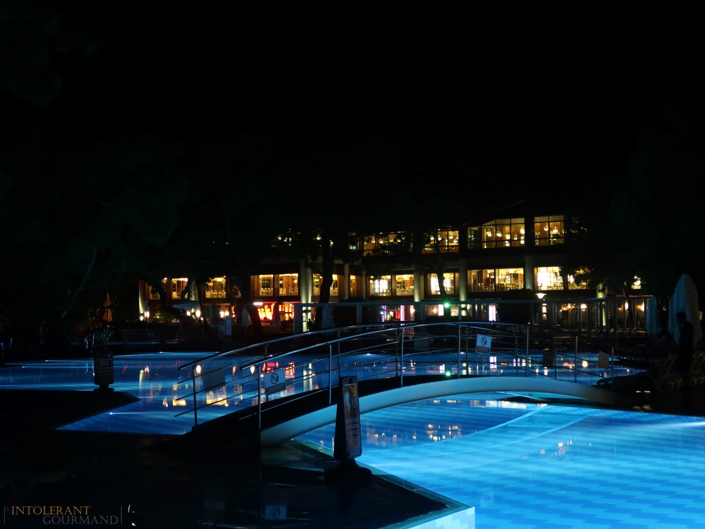 Rixos Sungate Kemer Antalya with Jet 2 Holidays - hotel at night, lights under the swimming pool. www.intolerantgourmand.com